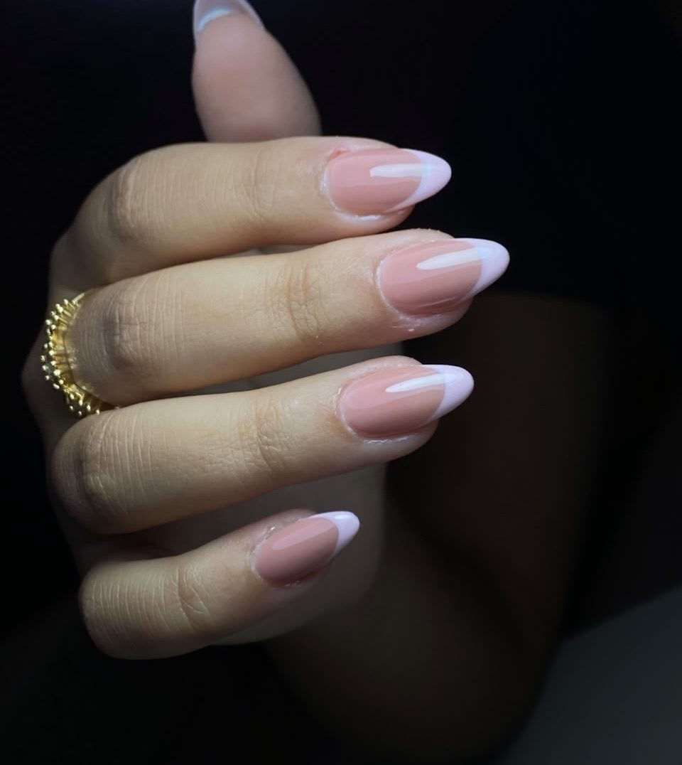 Soft pink French-tip almond nails